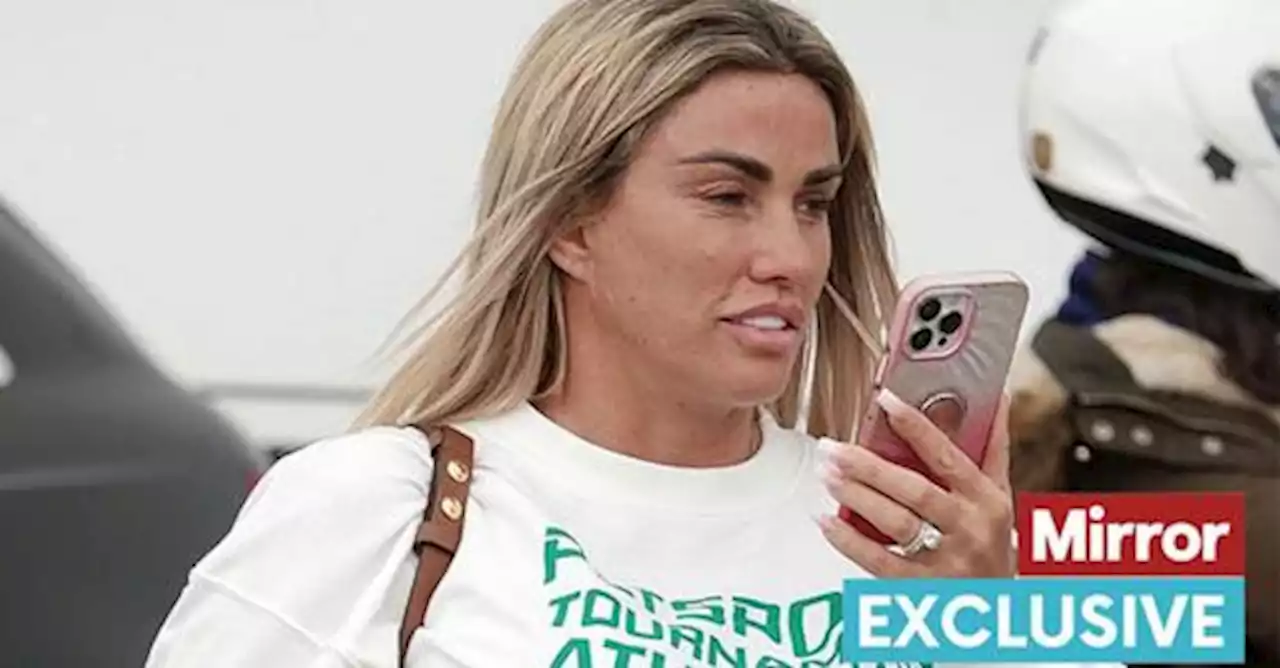 Katie Price flashes engagement ring as she returns from holiday with 'ex' Carl