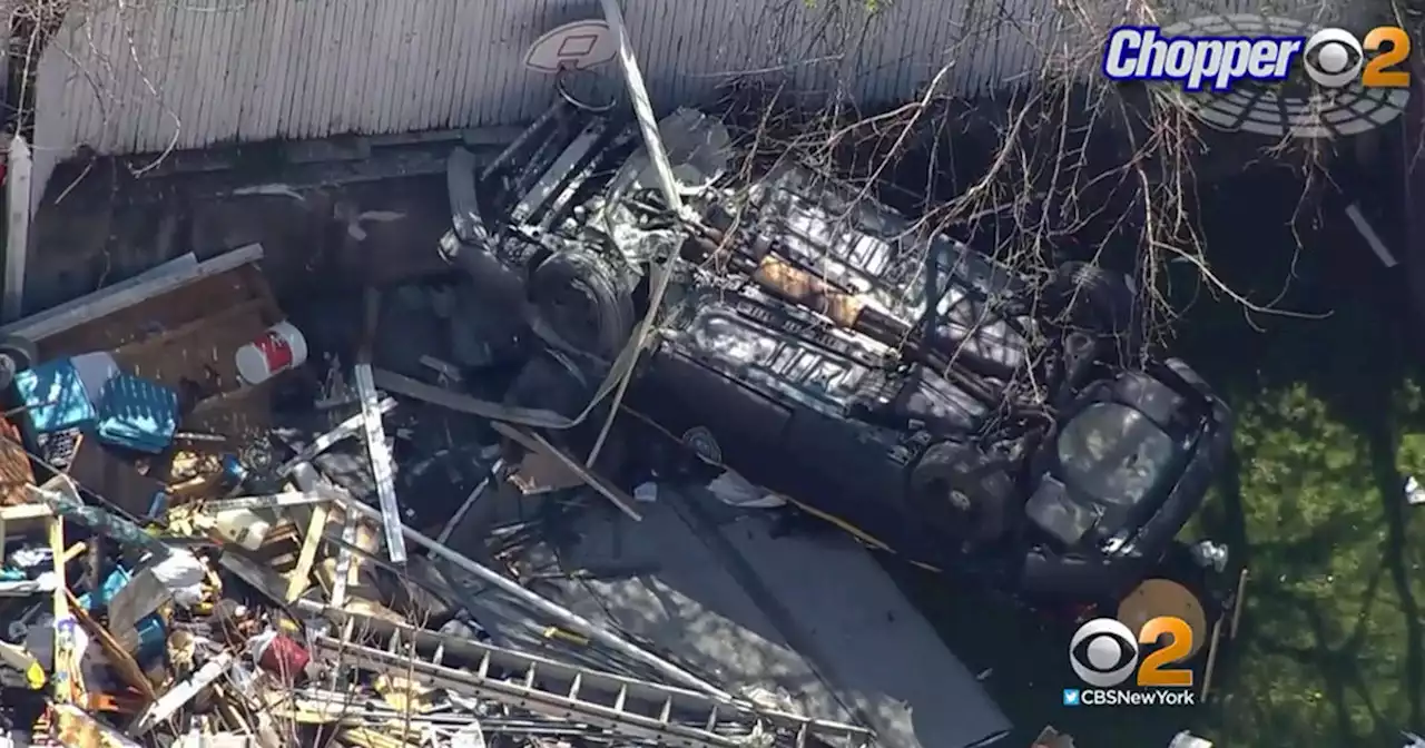 MTA police vehicle crashes through fence, flips into Staten Island homeowner's backyard