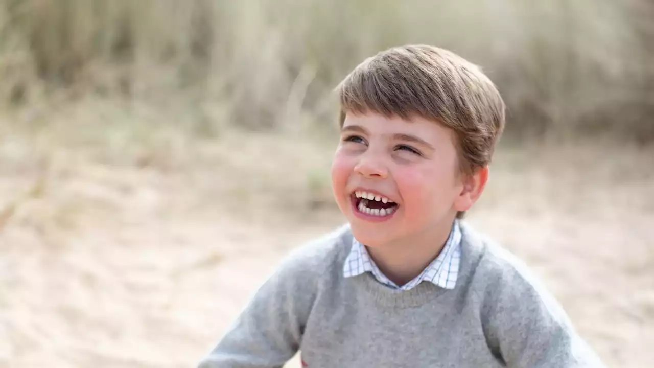 Prince Louis beams as he plays on sand in photos to celebrate his 4th birthday