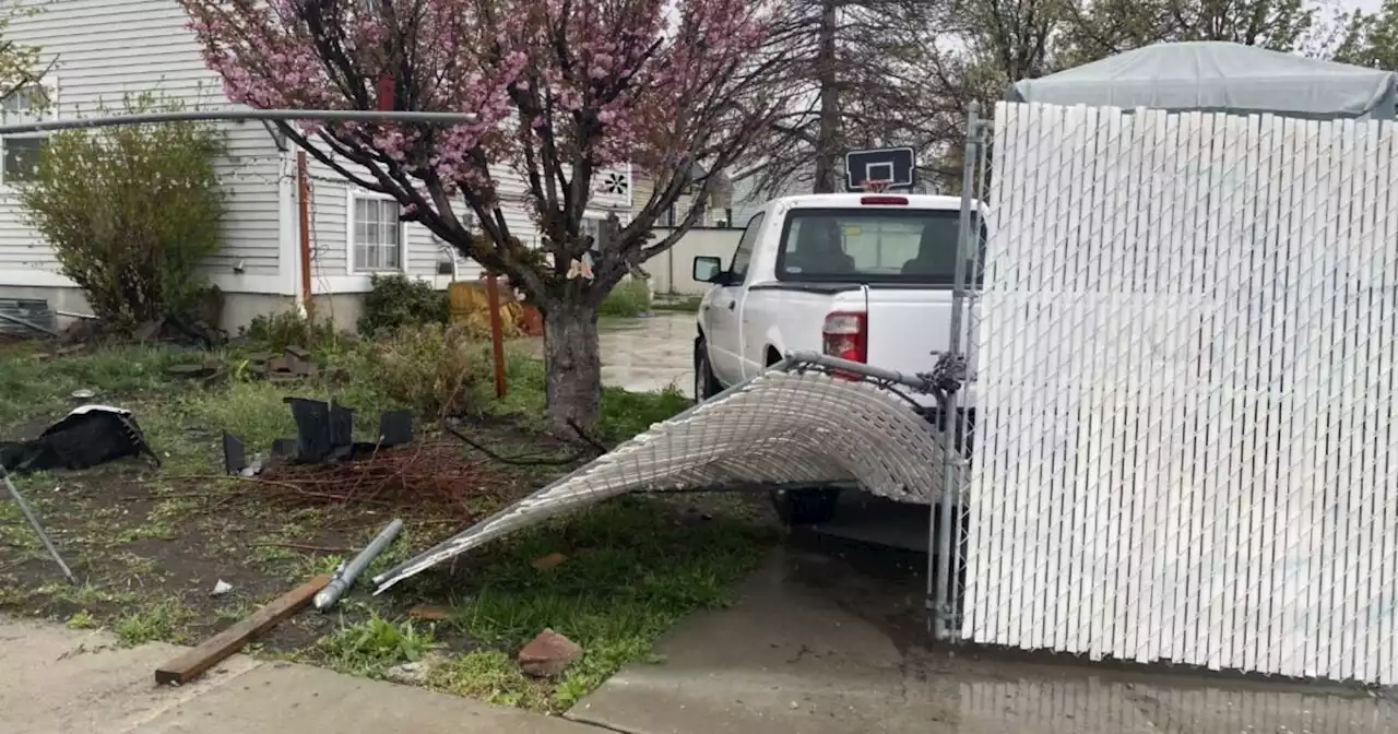 Driver crashes through Salt Lake City fence and yard, runs away