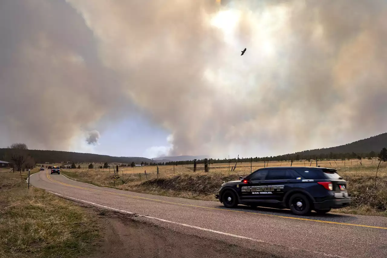 Wildfires merge in New Mexico, threatening rural villages