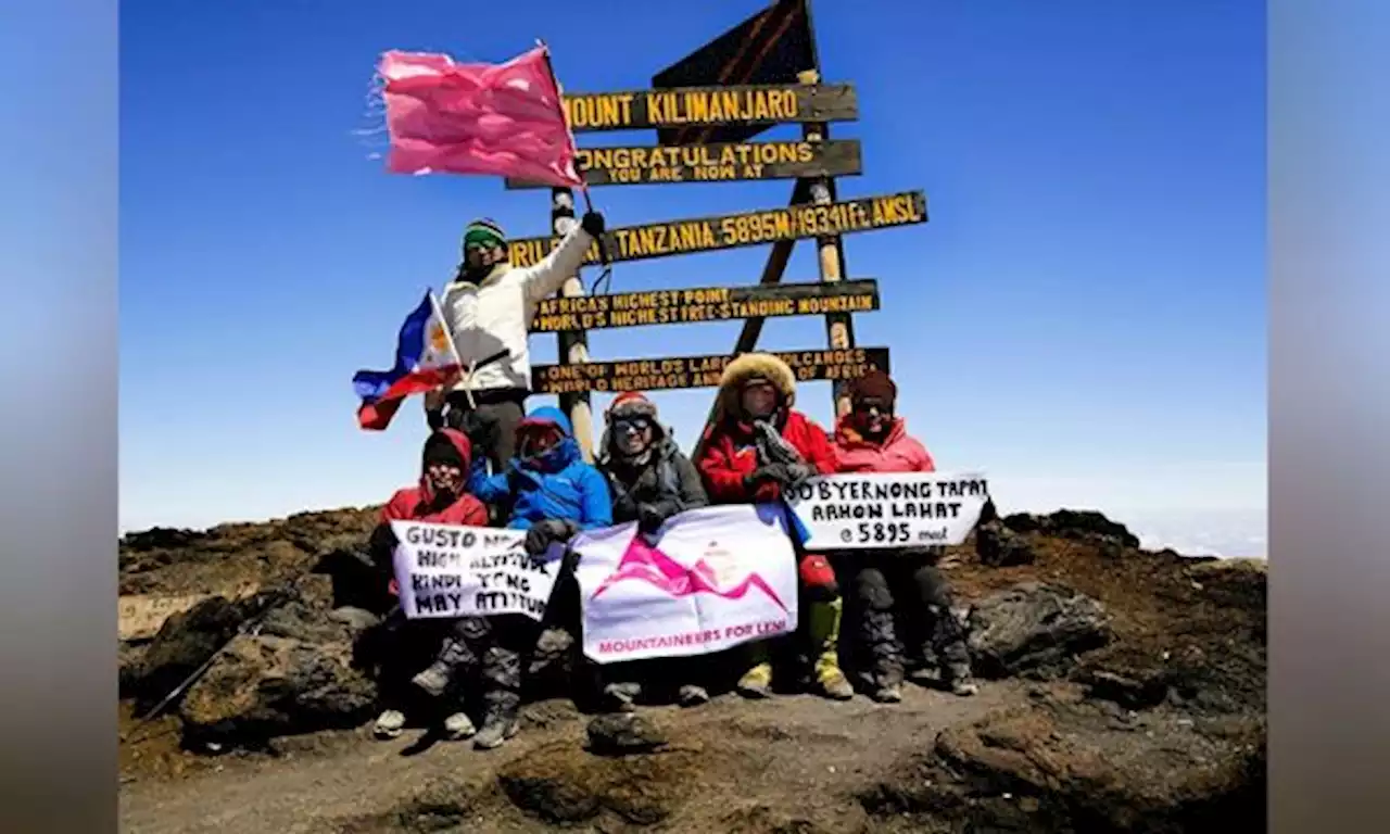 Filipino trekkers unveil pink flag atop Africa’s highest mountain