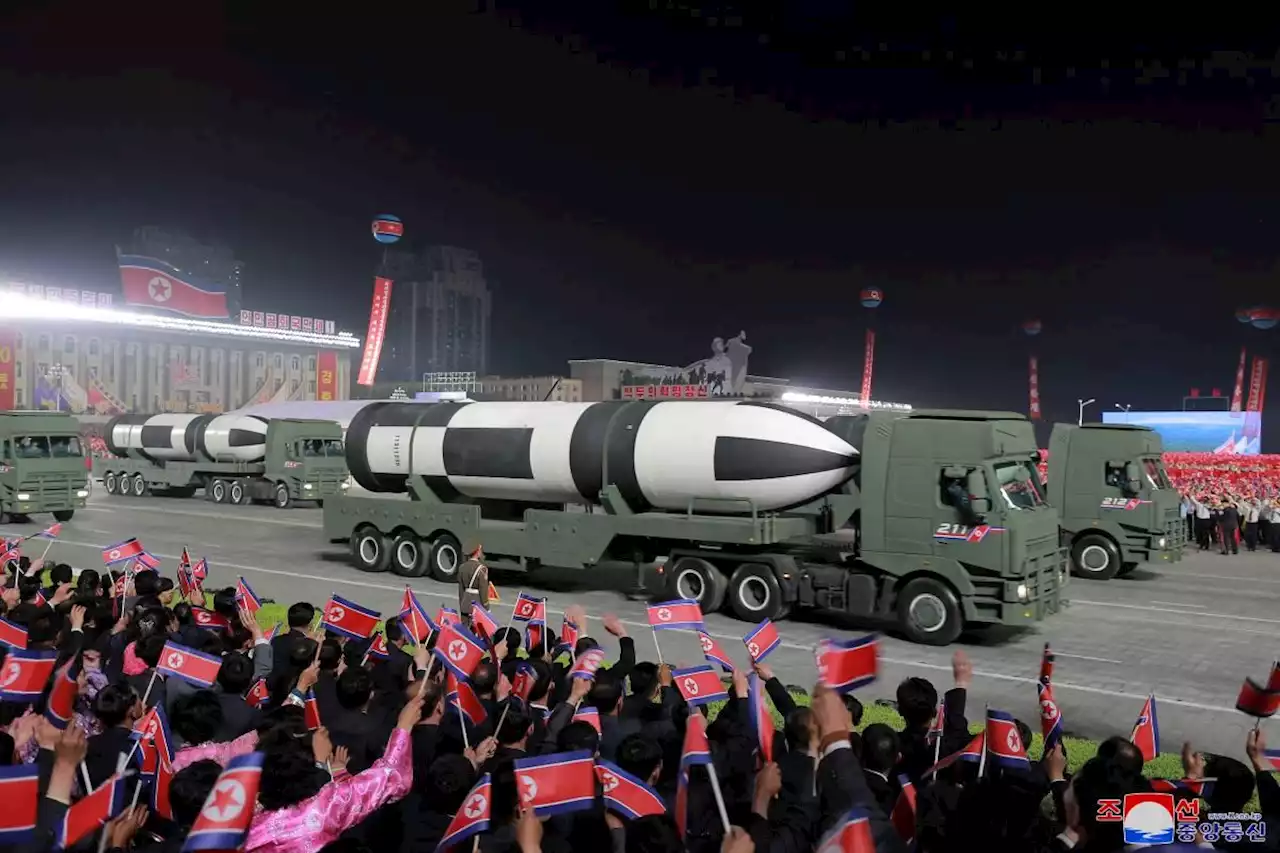 North Korea displays ICBMs at huge parade, vows to boost nuclear arsenal