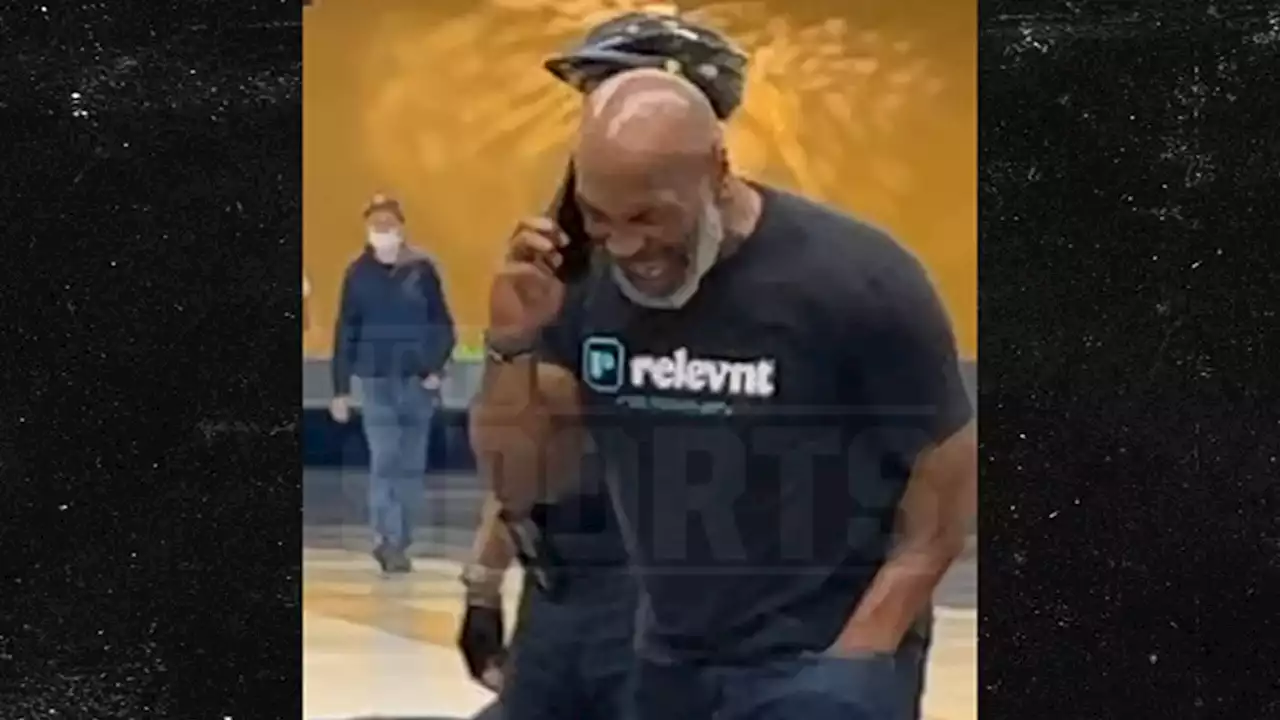 Mike Tyson Laughs On Phone After Airplane Beatdown