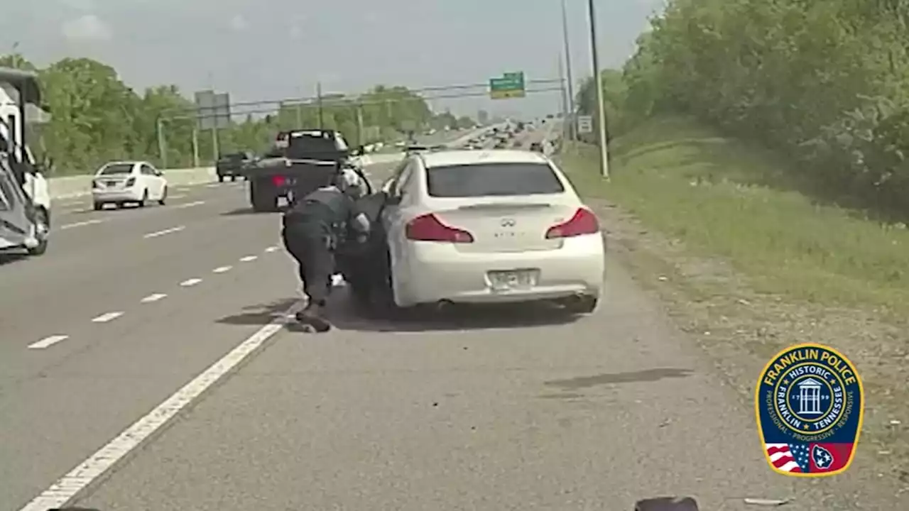 Dashcam video captures suspect drag two Tennessee police officers, run one over