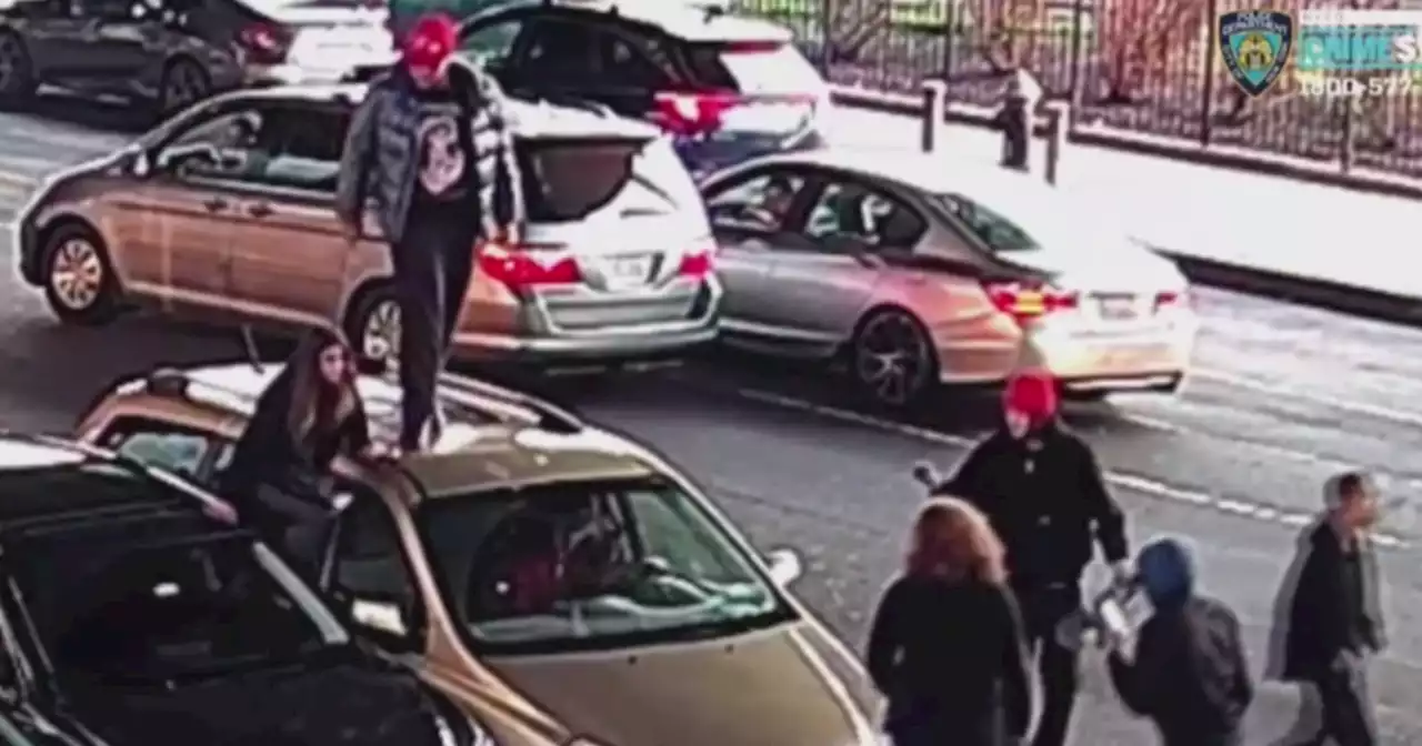 Caught on video: Carjacking suspects jump on top of van, start attacking driver