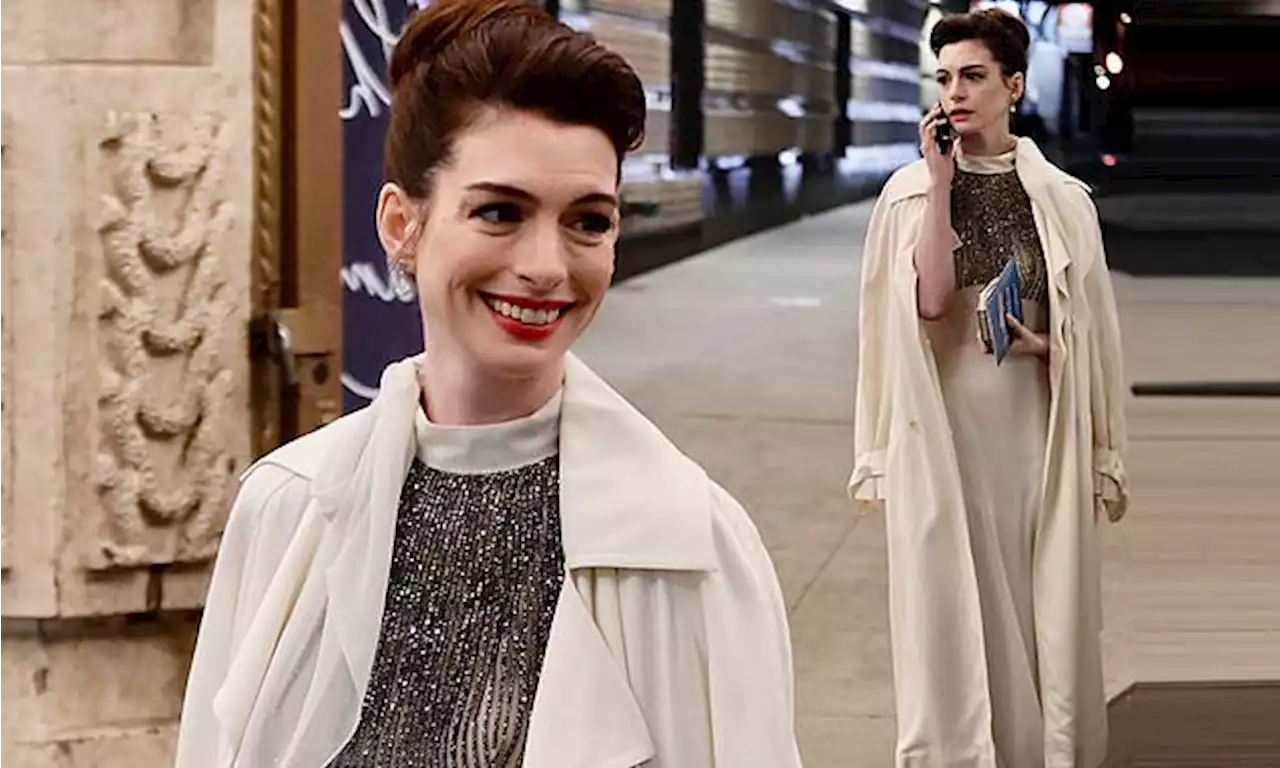 Anne Hathaway looks elegant in a floor length gown as she films