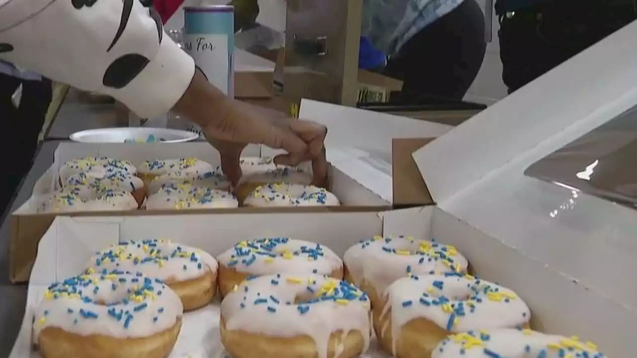 Lockport high school students raise money for Ukraine by selling flowers, donuts