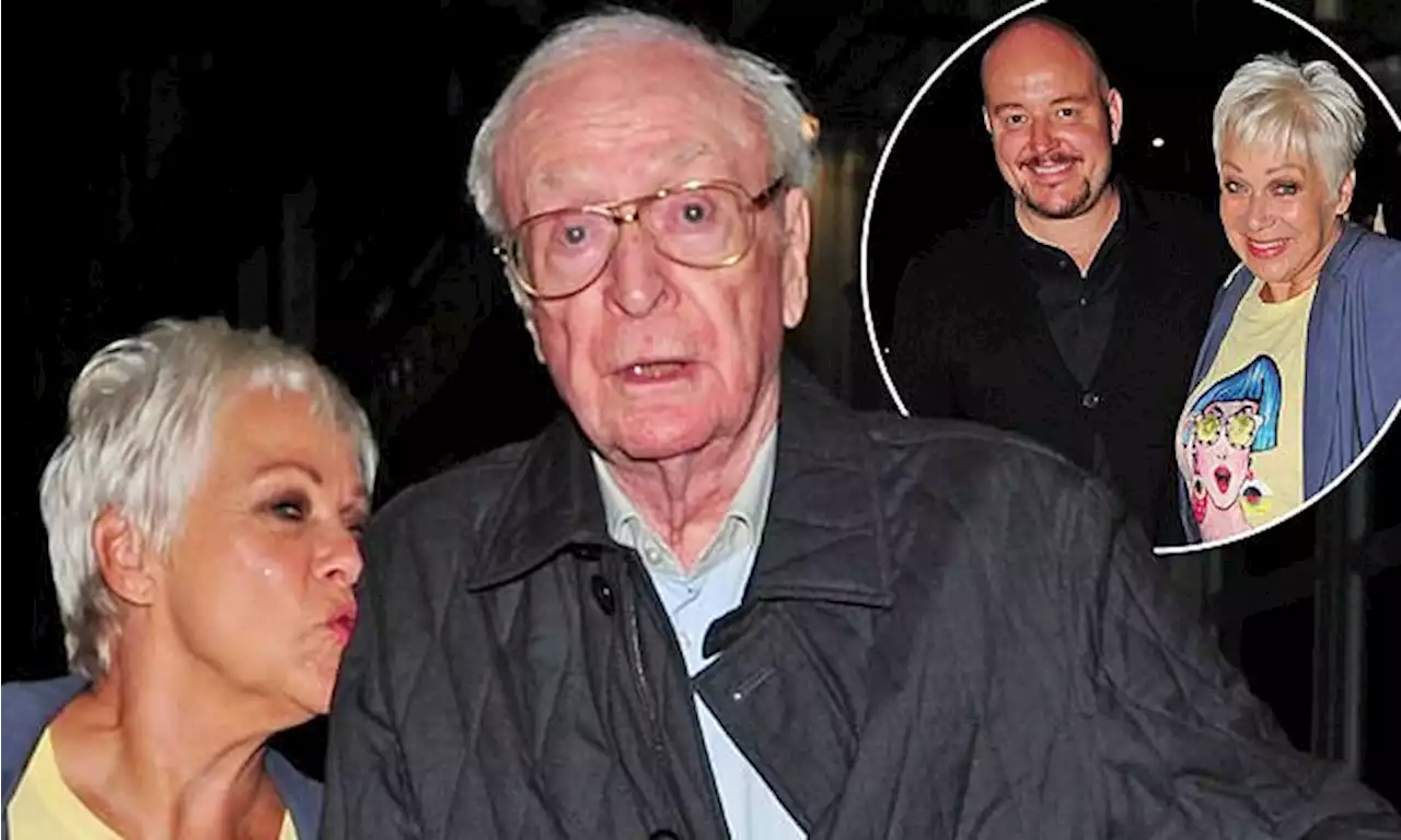 Denise Welch kisses Michael Caine's shoulder during double date