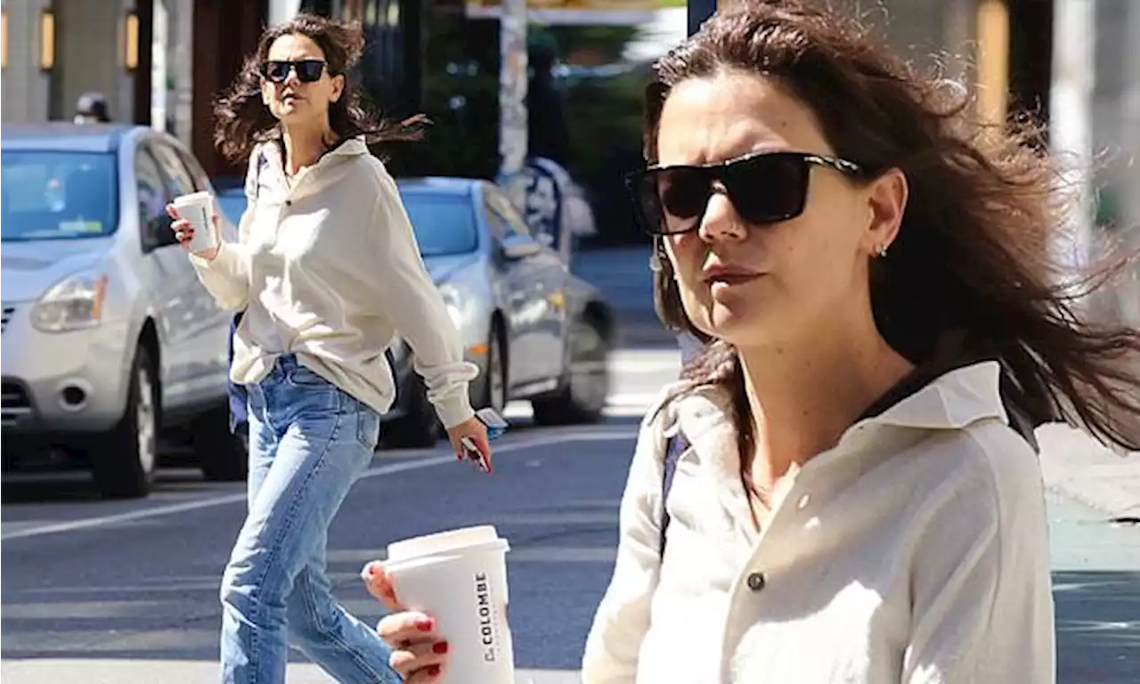 Katie Holmes enjoys La Colombe coffee on a windy day in NYC