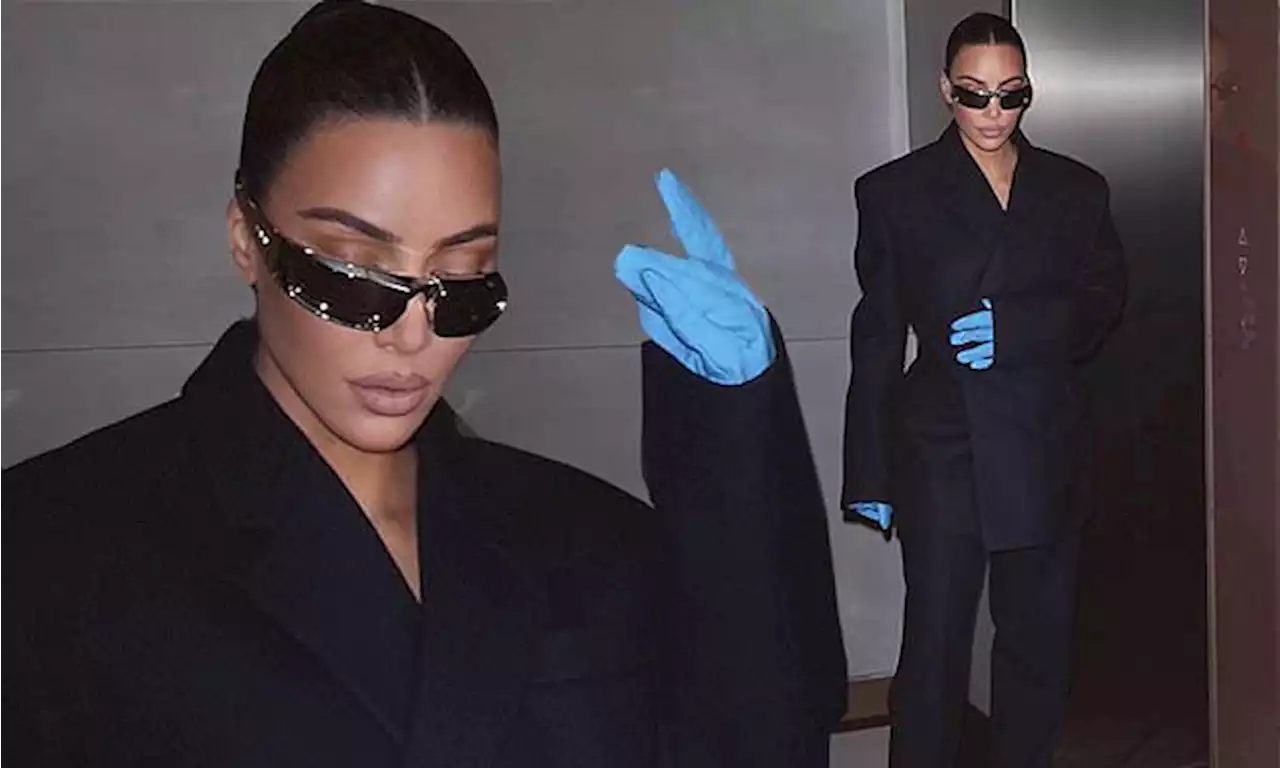 Kim Kardashian covers her iconic curves in an oversized suit