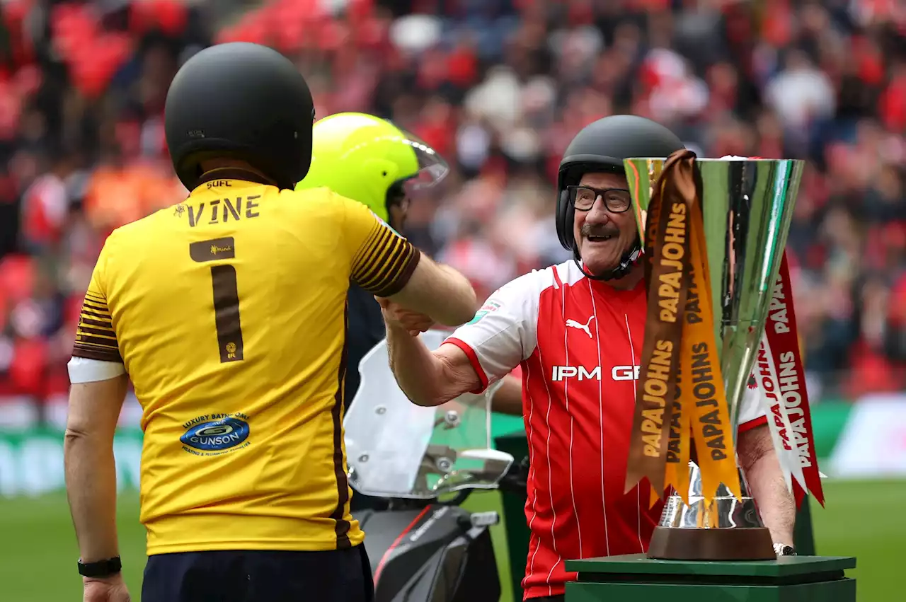 Paul Chuckle rides onto Wembley turf on a moped to delivery Papa John's trophy