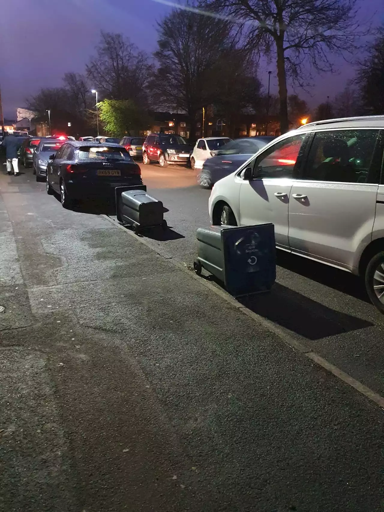 Fed up residents block drivers with WHEELIE BINS to save parking spaces