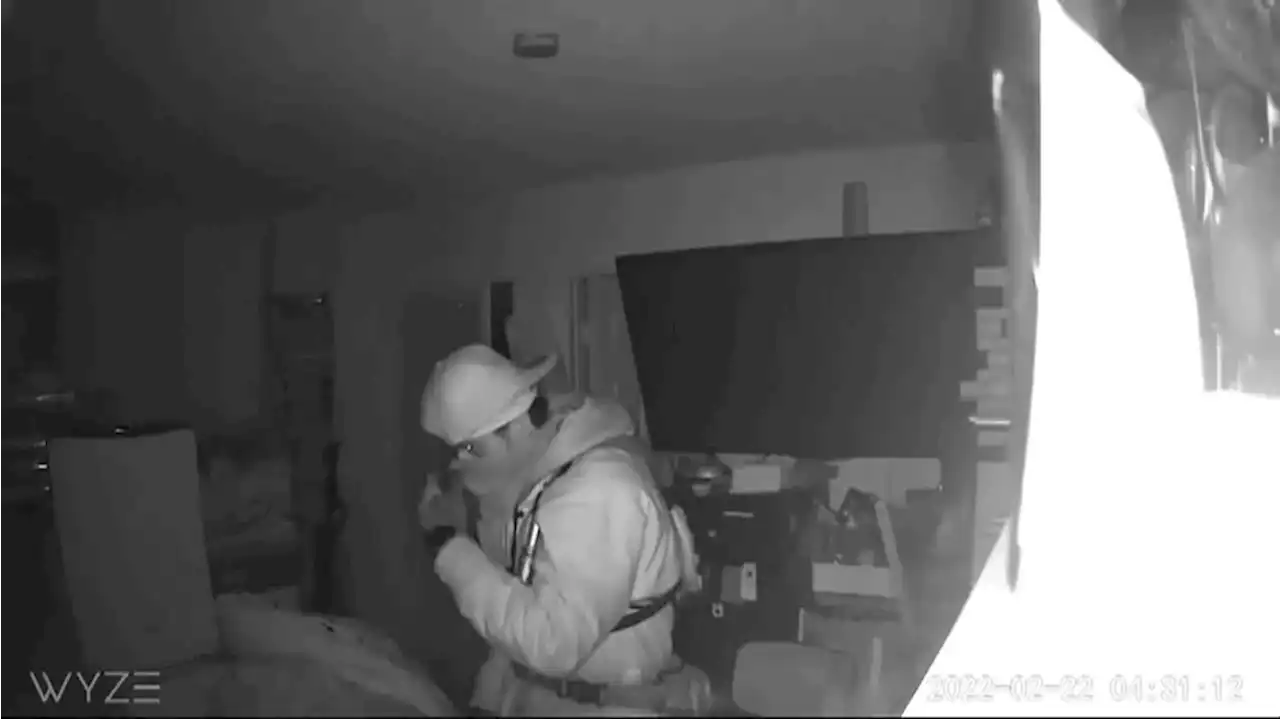 Intruder caught on camera standing over sleeping couple