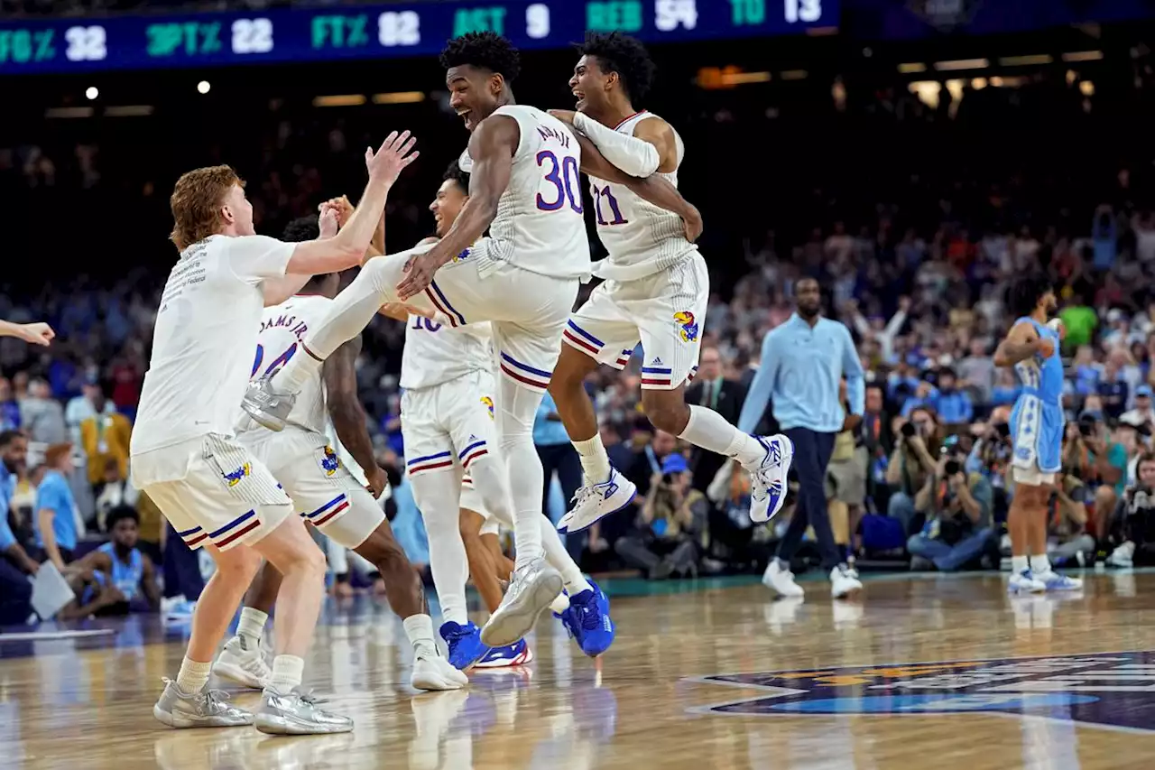 Kansas’ record rally from a 16-point deficit edges North Carolina 72-69 for the Jayhawks’ 4th NCAA title