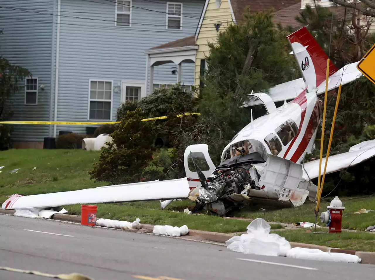 Small plane crashes in front of N.J. house, landing on top of car