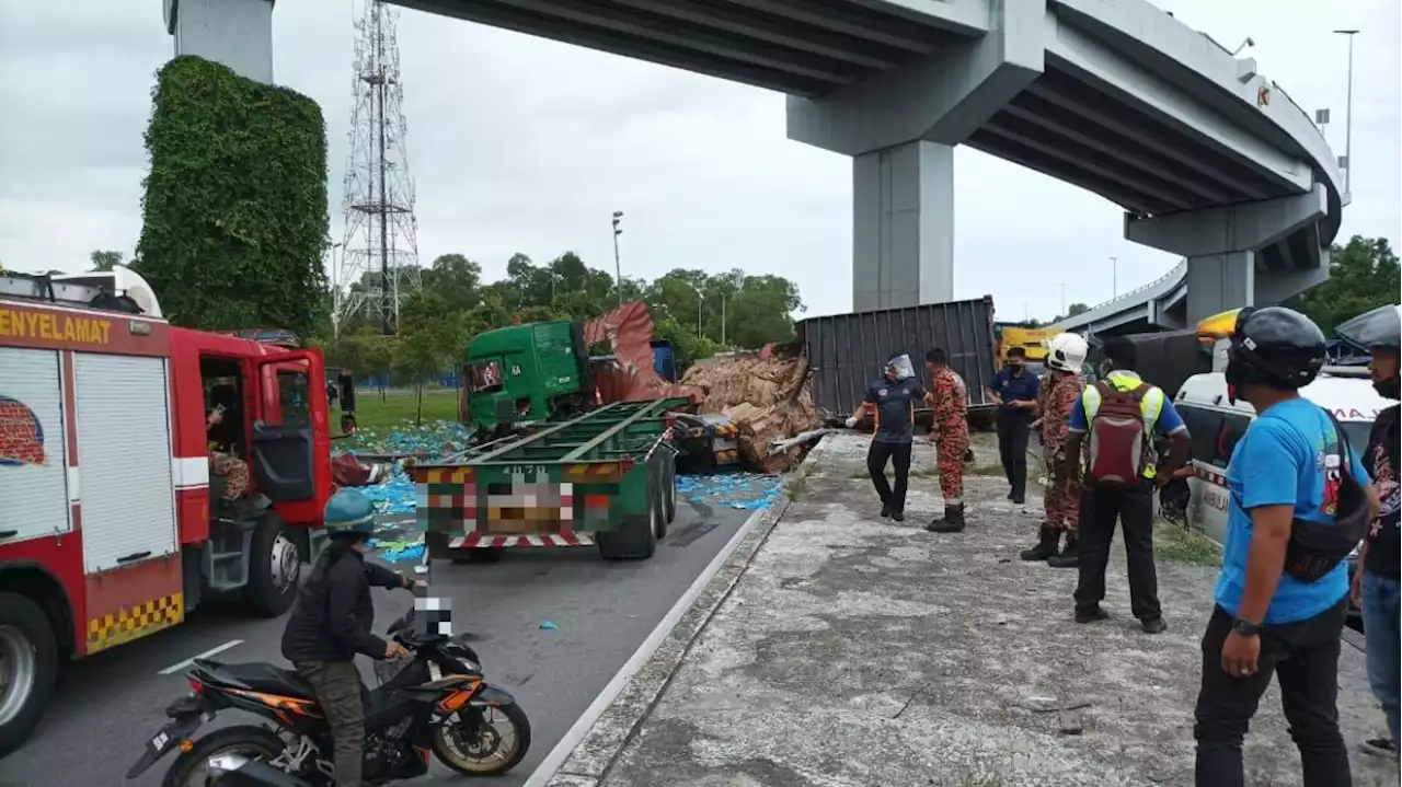 Shipping container falls off Klang flyover, smashes into two lorries below