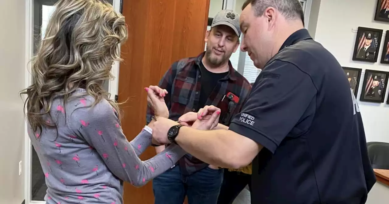 Utah woman accidentally locked in real handcuffs by kids