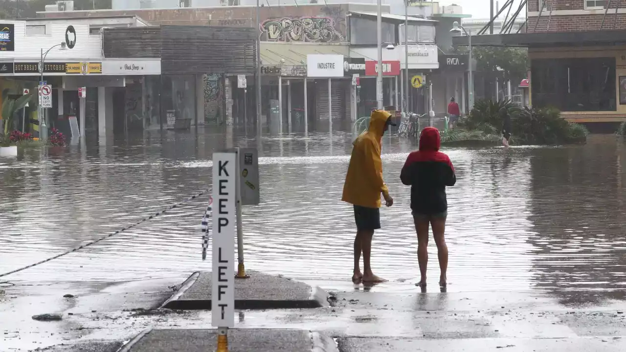 Sydney surpasses average annual rainfall as PM flags conditions for Queensland flood relief package