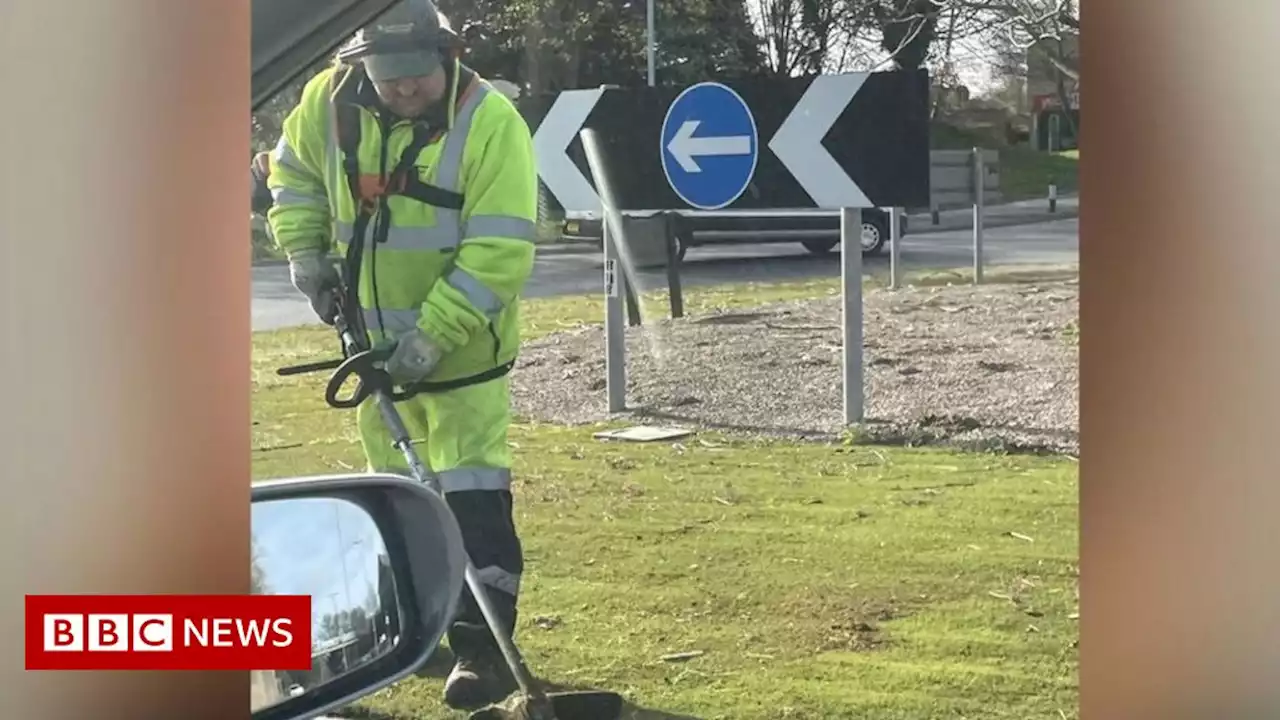 Council cut artificial grass on roundabout