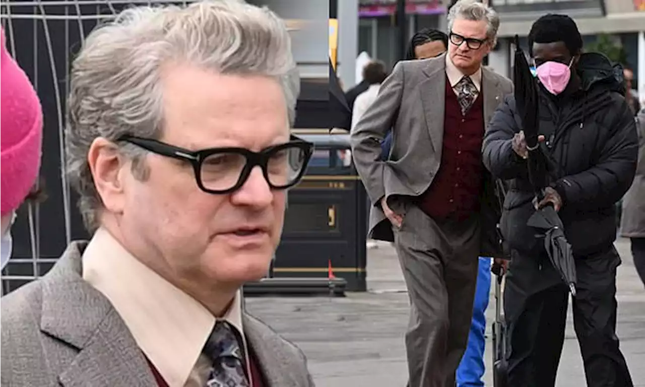 Colin Firth looks dashing in a grey suit as he begins filming