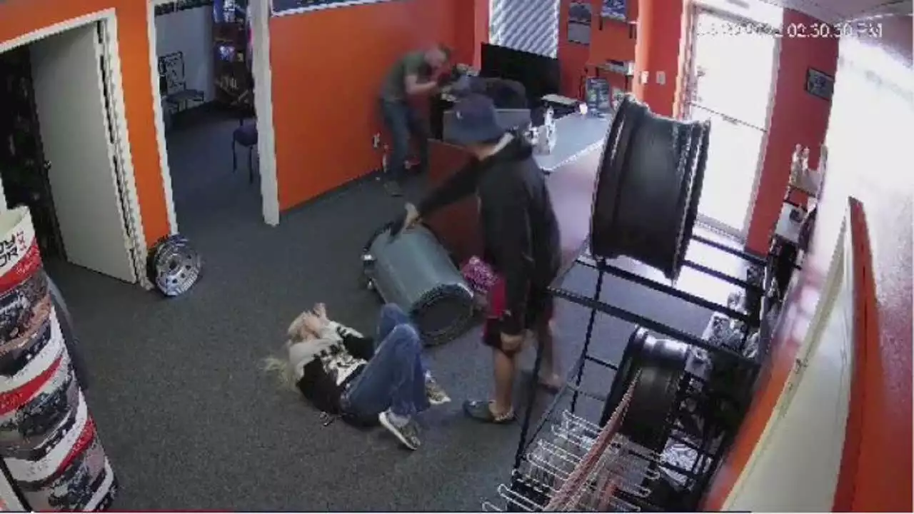 Man arrested, charged in violent robbery of auto shop caught on camera