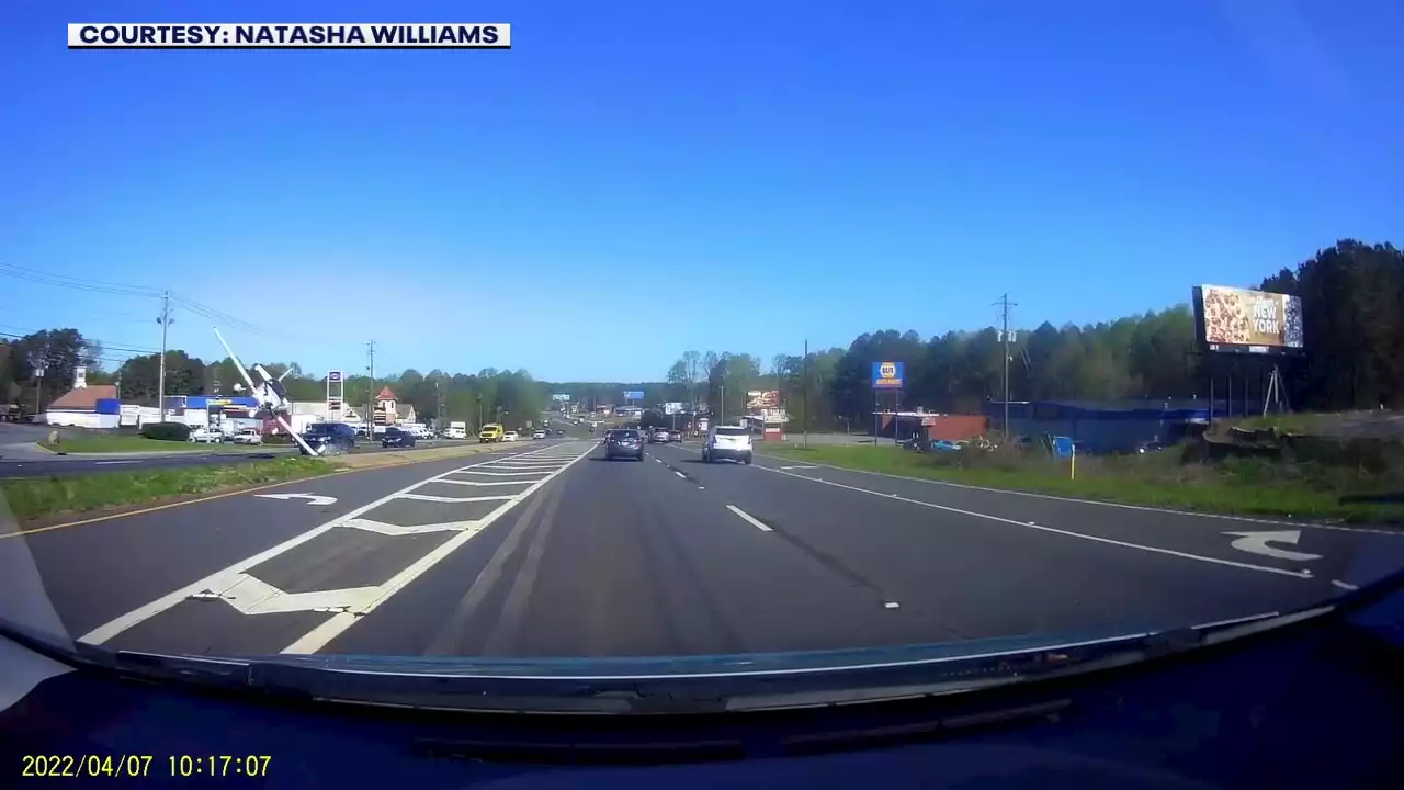 Driver's dashcam captures moment small plane crashes on Cobb Parkway