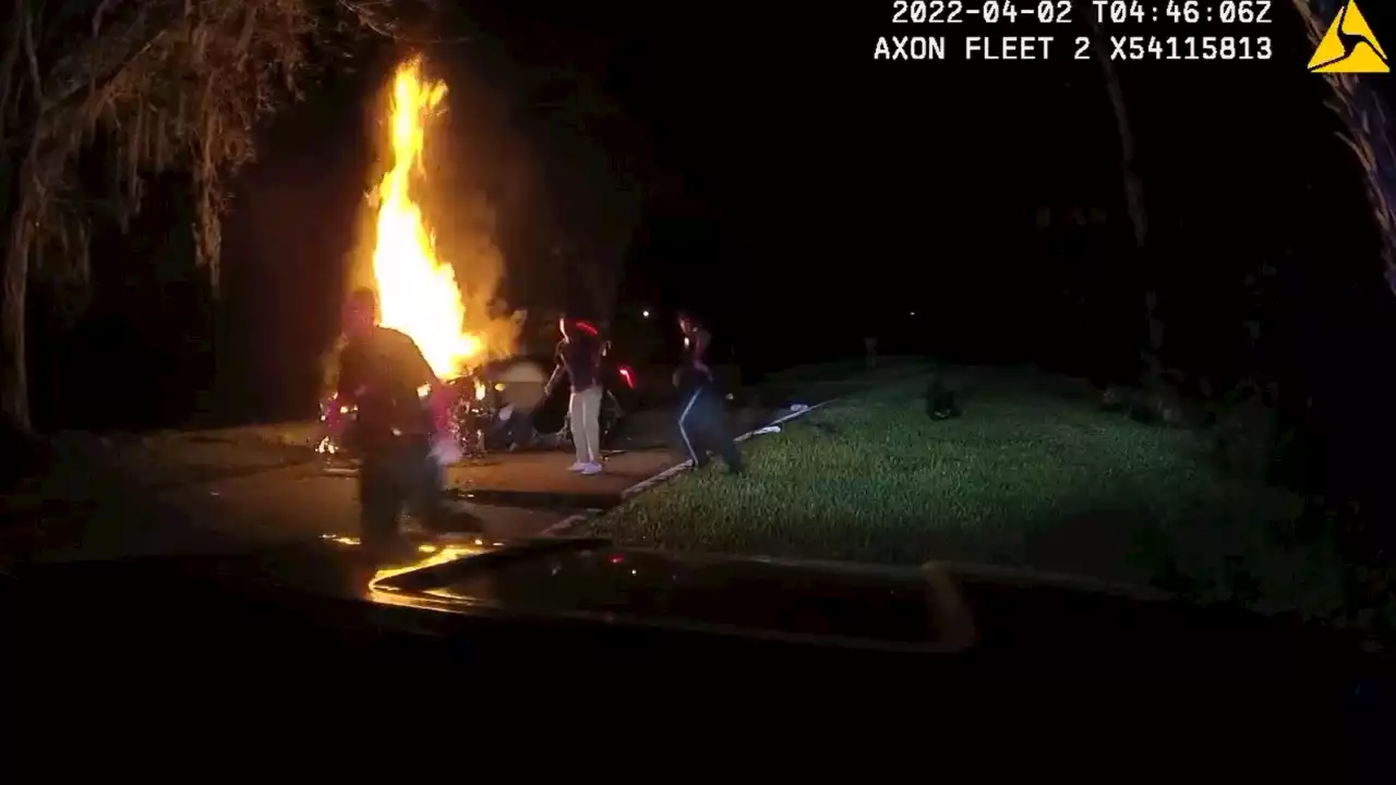 Florida police save man trapped inside burning vehicle