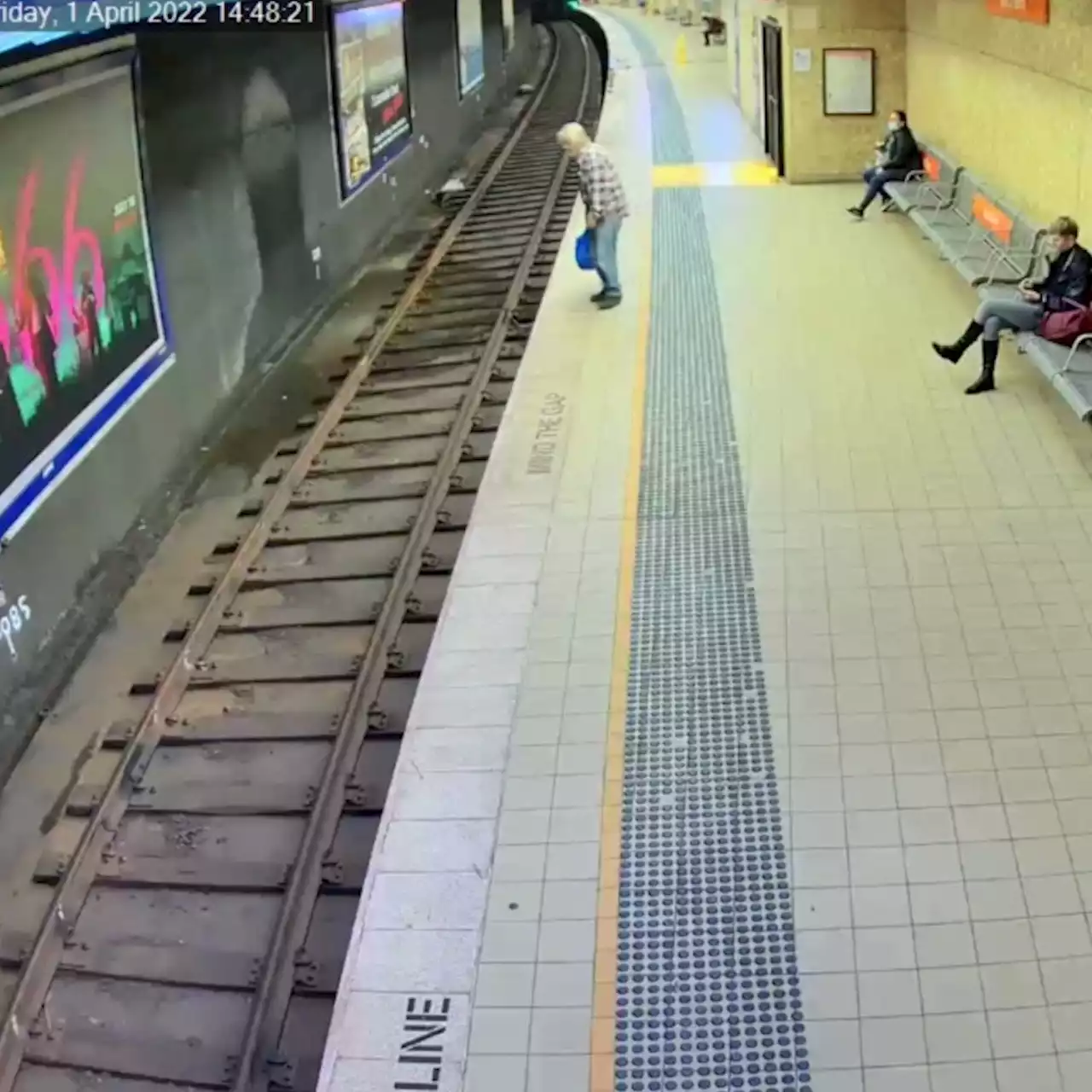 Man who nearly died after falling on Sydney train tracks arrested in hospital