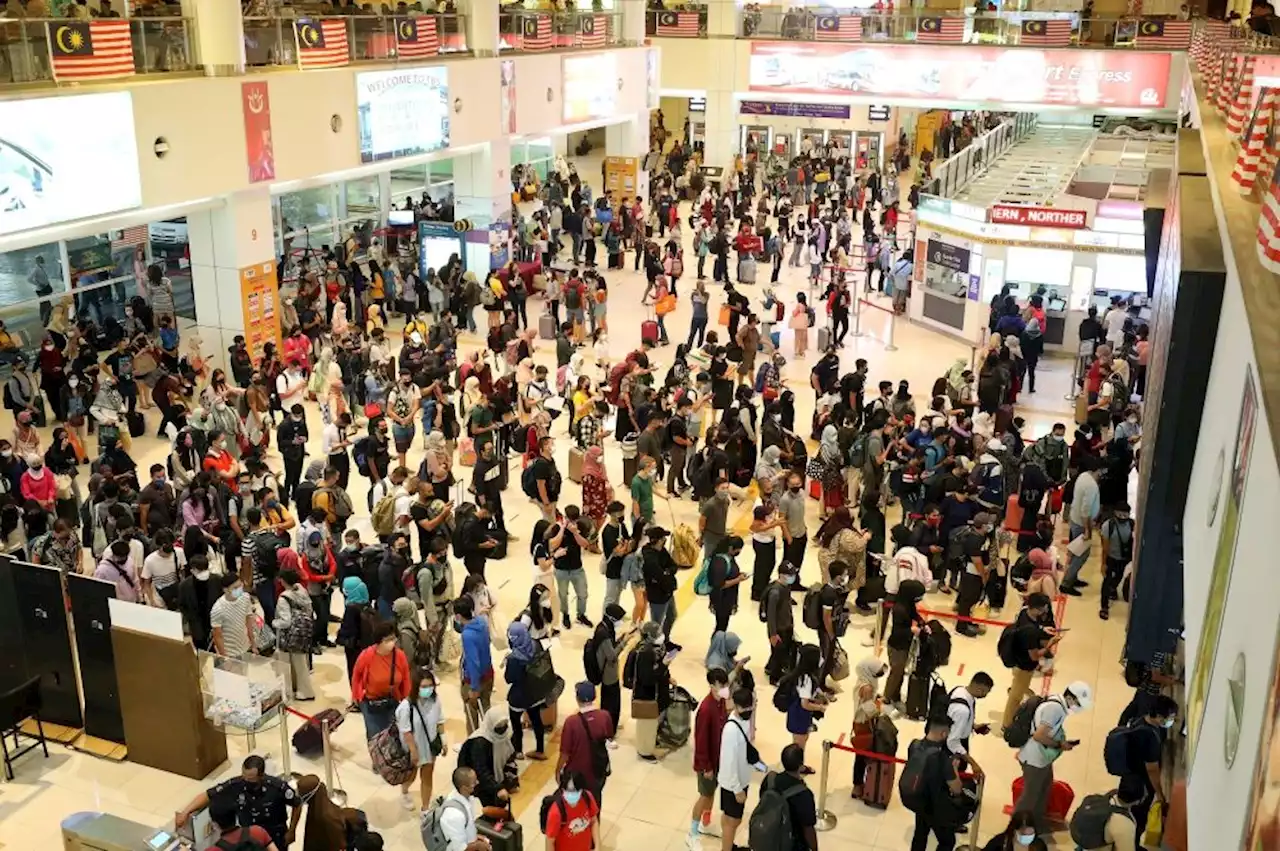 Last-minute rush for tickets at bus terminal