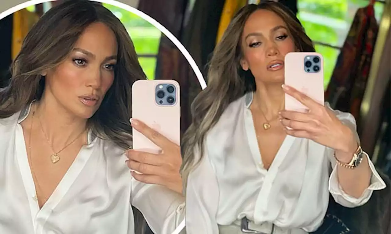 Jennifer Lopez looks fierce as she snaps selfies and gets makeup done