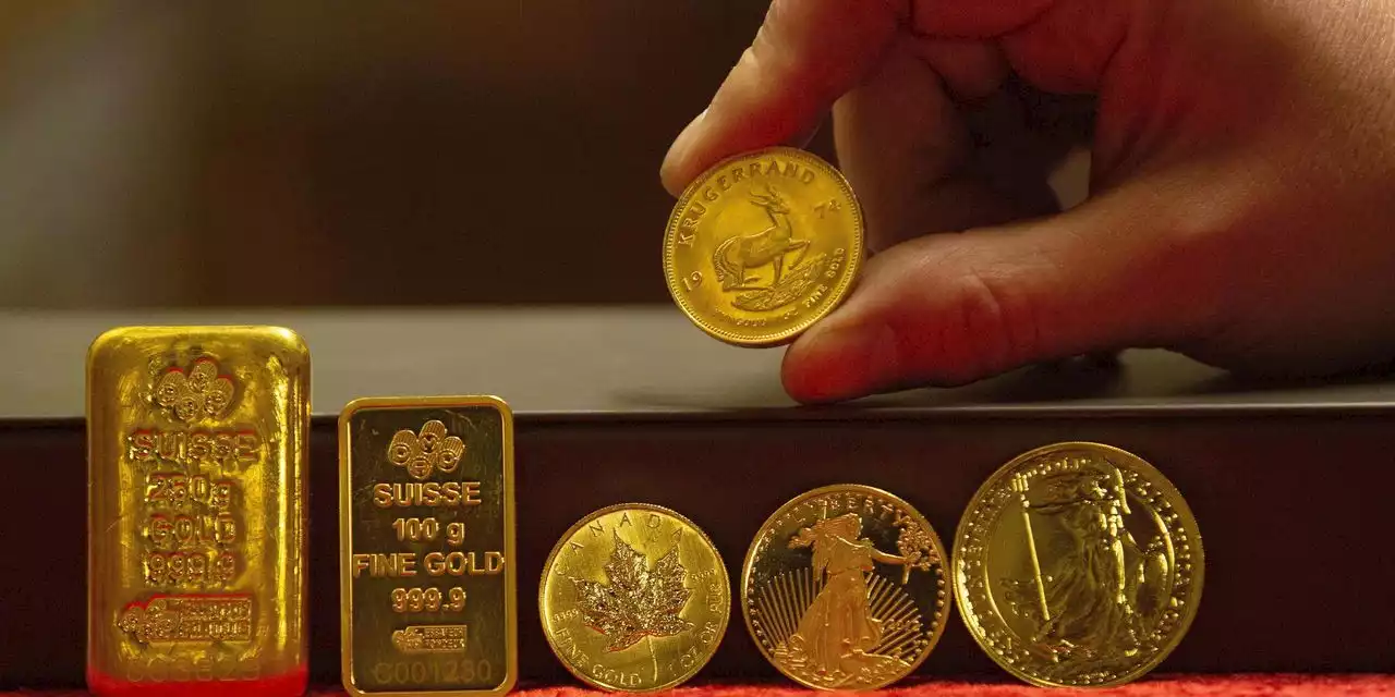 Gold little changed as dollar rally cools