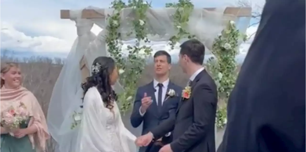 Couple flip coin during marriage ceremony to decide which surname to take