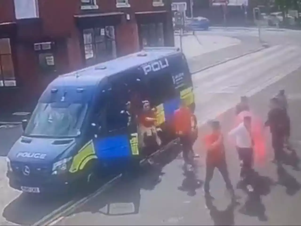 Police force launches probe after football fans given lift to pub in back of riot van