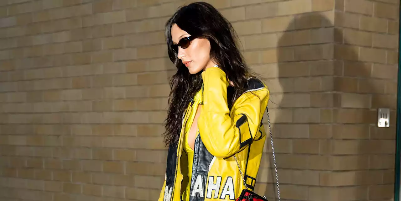 Bella Hadid Goes Transformers-core in a Yellow Leather Racing Jacket