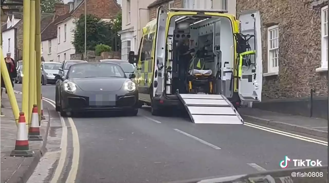 Woman blasts Porsche driver 'blocking road as he 'thinks it's a tank''