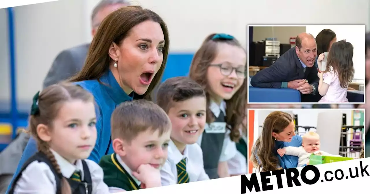 William jokes about Kate being broody while she cuddles baby at school visit