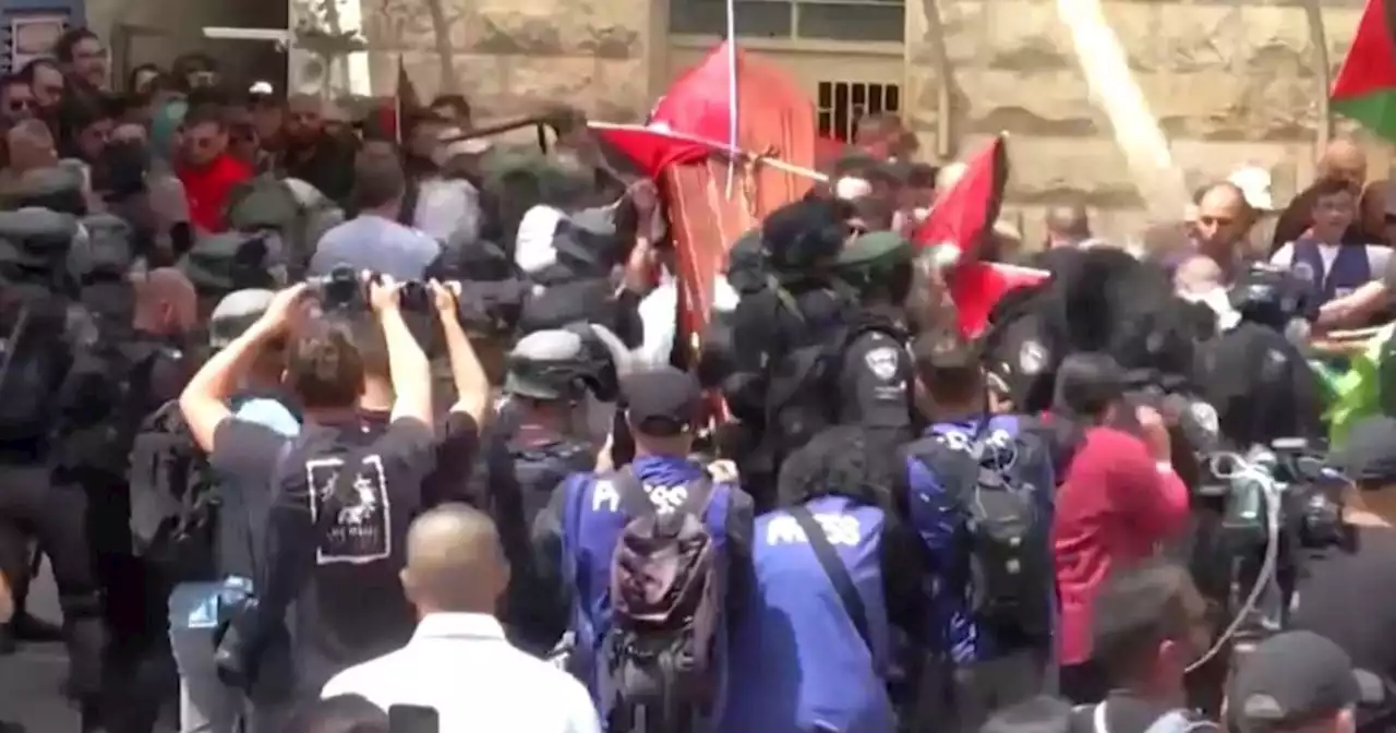 Shireen Abu Akleh funeral sees clashes between Israeli forces and Palestinian mourners in Jerusalem