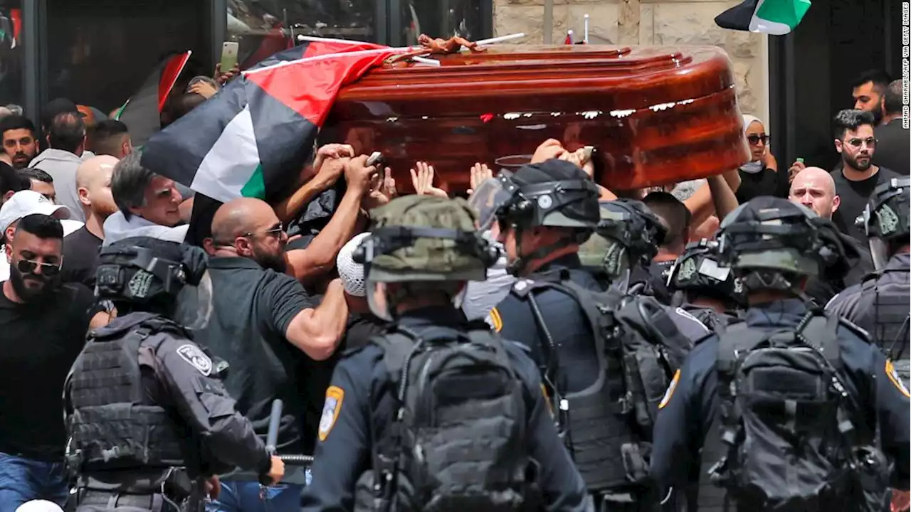 Israeli police beat mourners with batons at funeral procession for veteran journalist