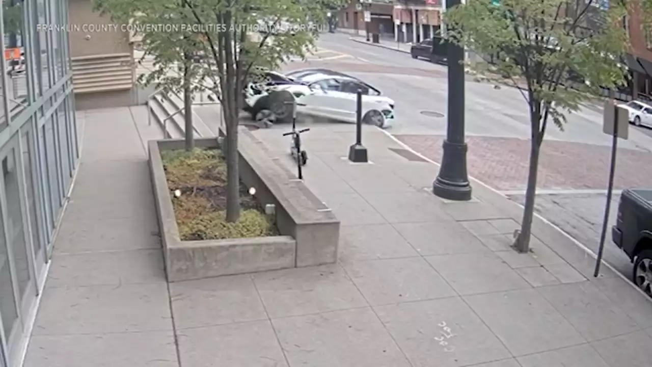 Video: Tesla jumps curb and crashes straight into convention center in Ohio