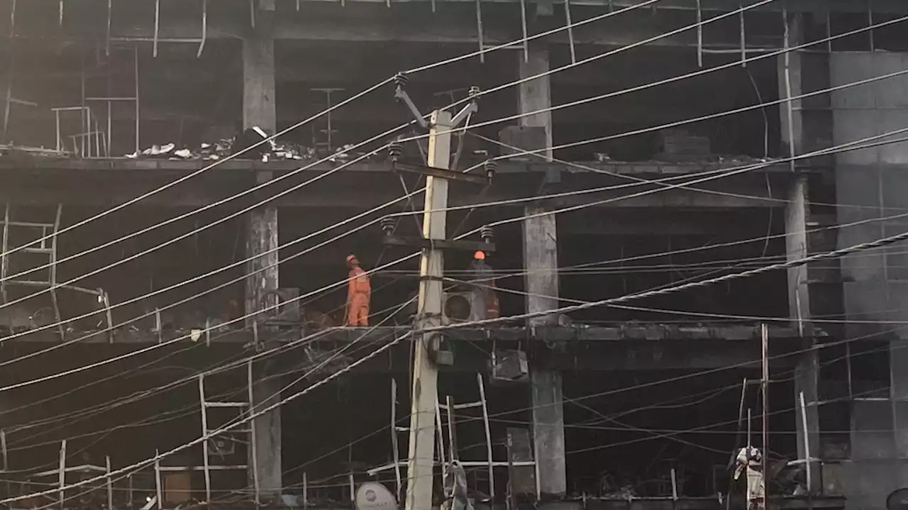 Police arrest 2 after building fire kills 27 in New Delhi