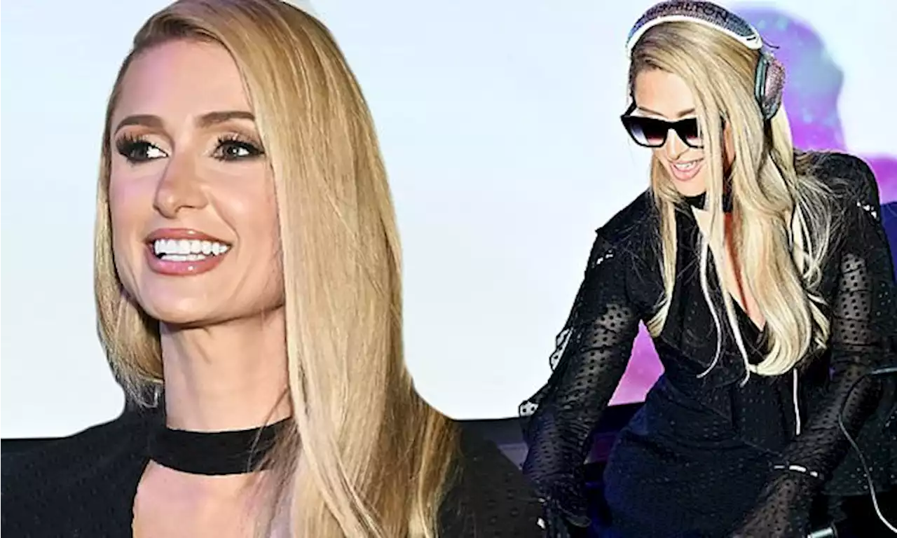 Paris Hilton cuts a chic figure in a plunging black dress as she DJ's