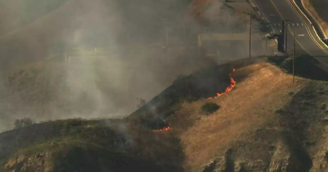 LAFD firefighters battle brush fire in Lopez Canyon, near landfill