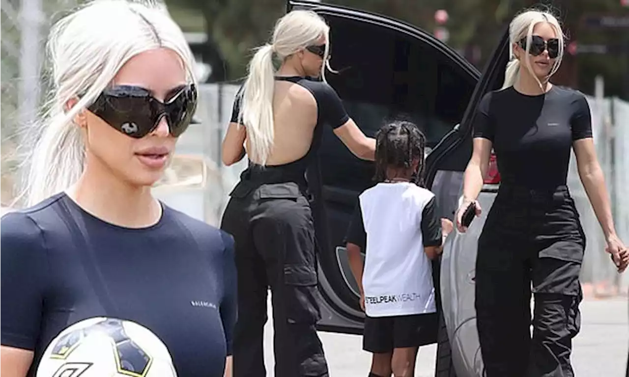 Kim Kardashian rocks a backless top to cheer on her son's soccer game