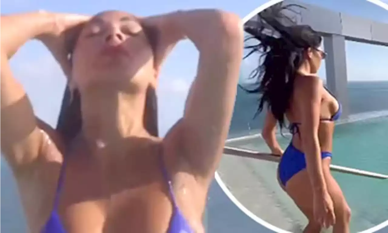 Nicole Schzinger turns up the heat in a plunging blue bikini in Mexico