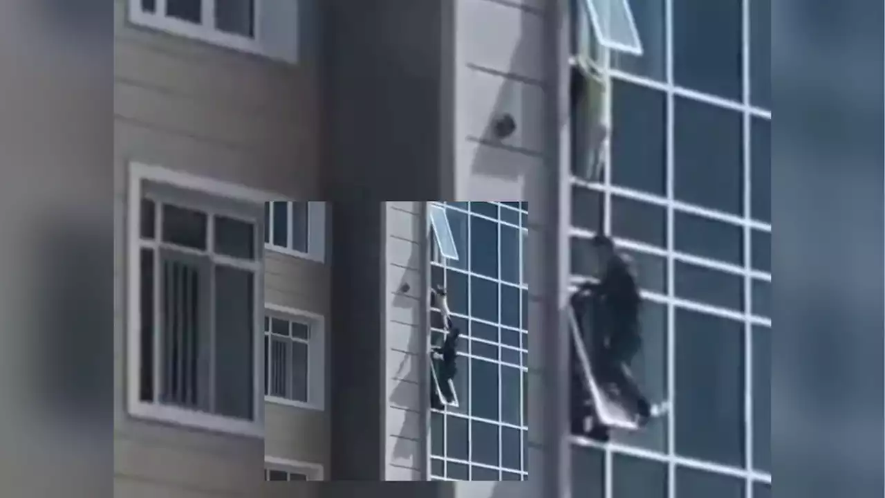 Kazakh man hailed a hero for risking own life to save toddler hanging from 8th floor