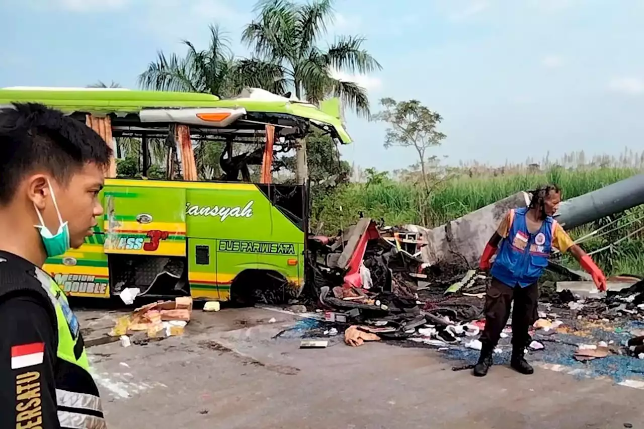 Indonesia tourist bus smashes into billboard, killing 14