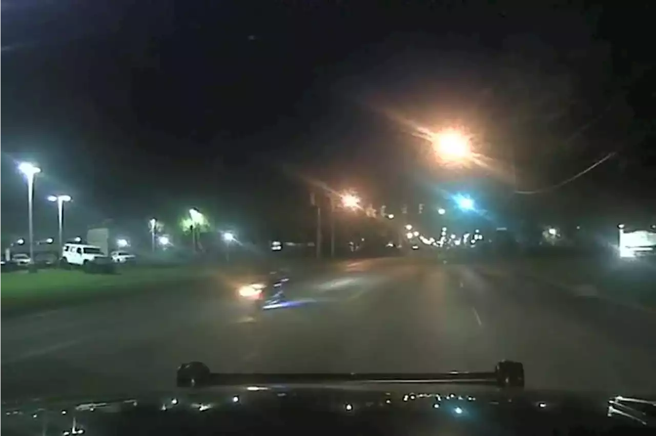 Speeding motorcyclist crashes into vehicle, curb during pursuit in Parma (dash camera video)