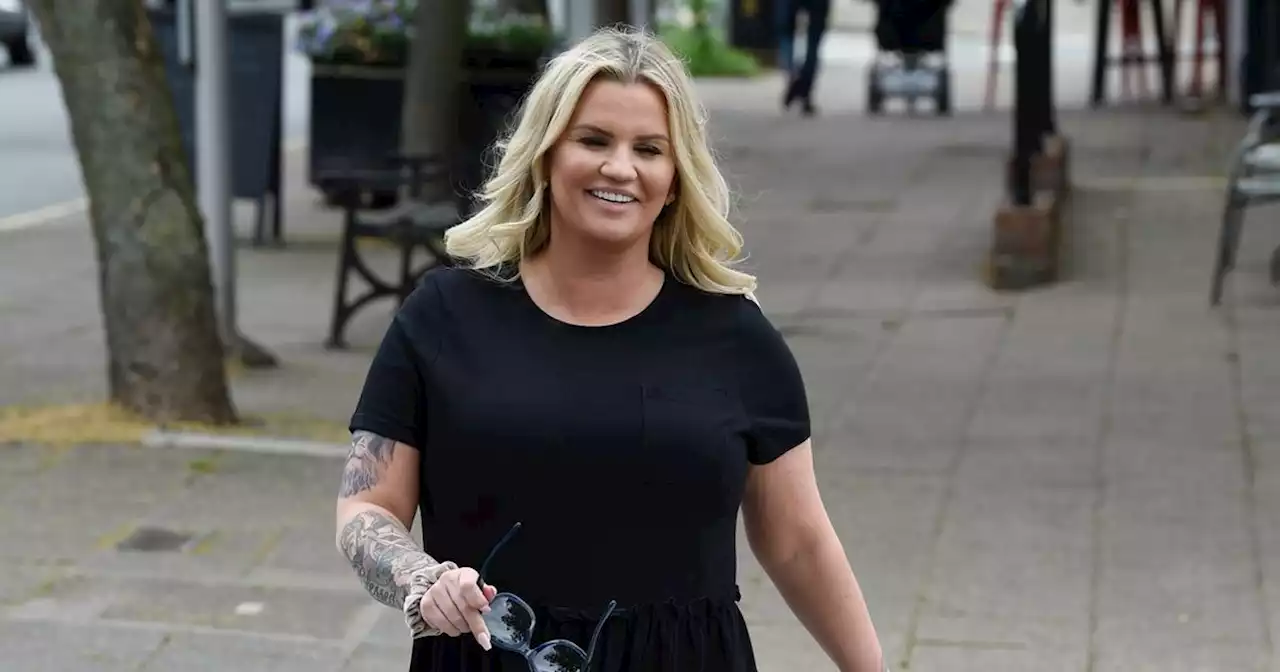 Kerry Katona beams as she's seen for first time since boob reduction