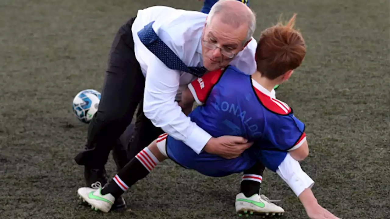 Watch: Australian PM accidentally tackles a child during a soccer match